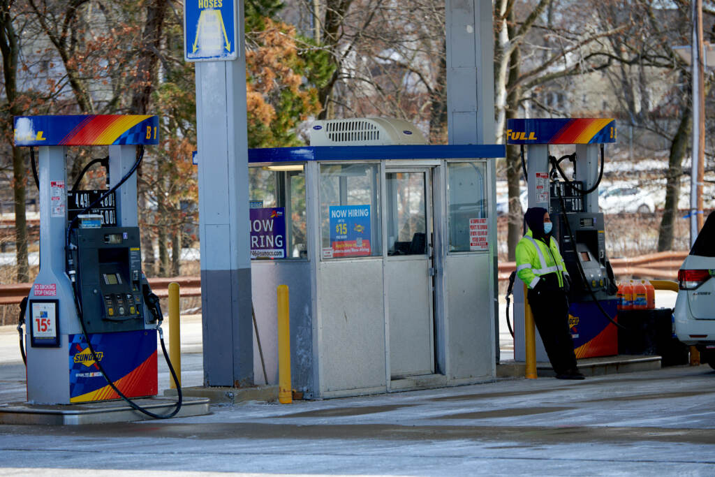 An attendant at a Sunoco gas station in Bloomfield, New Jersey, U.S., on Sunday, March 13, 2022. At a South Jersey gas station, orange cones block one of the lanes. Stations have shut down some pumps because owners have struggled to hire enough attendants, according to the New Jersey Gasoline-Convenience-Automotive Association. (Laura Benshoff/NPR)