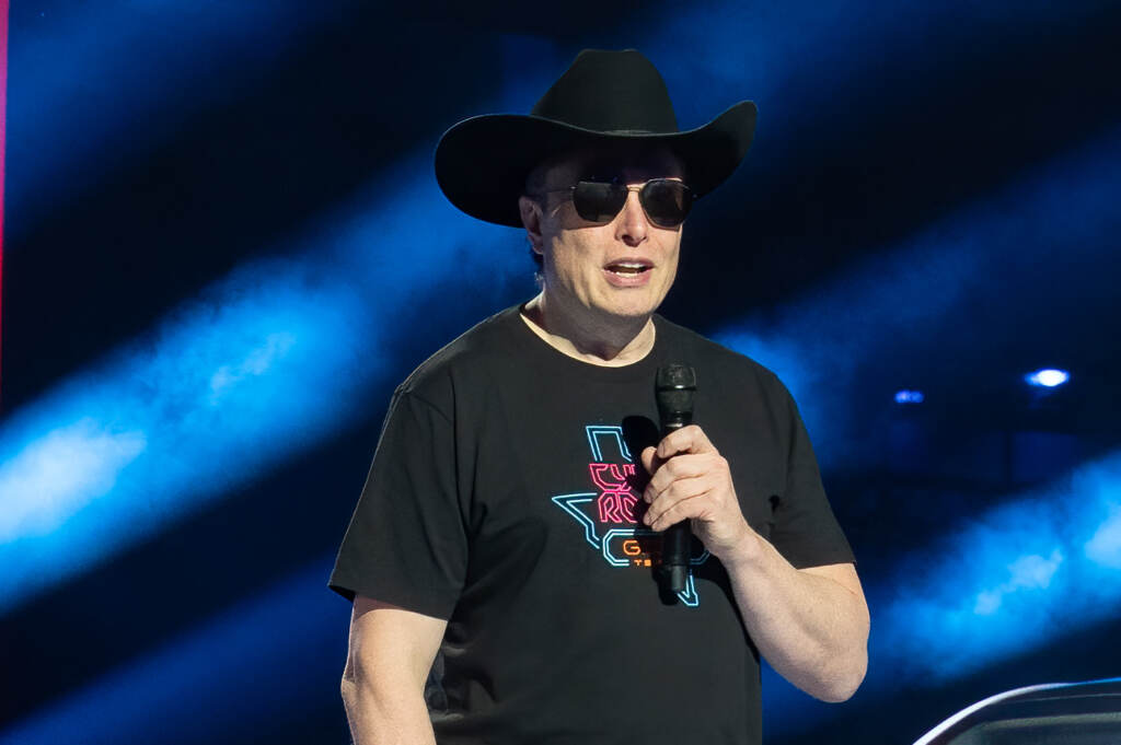 Tesla Elon Musk speaks at the Tesla Giga Texas manufacturing “Cyber Rodeo” grand opening party on April 7, in Austin, Texas. Musk is offering to buy Twitter for $43 billion in cash. Tesla Elon Musk speaks at the Tesla Giga Texas manufacturing