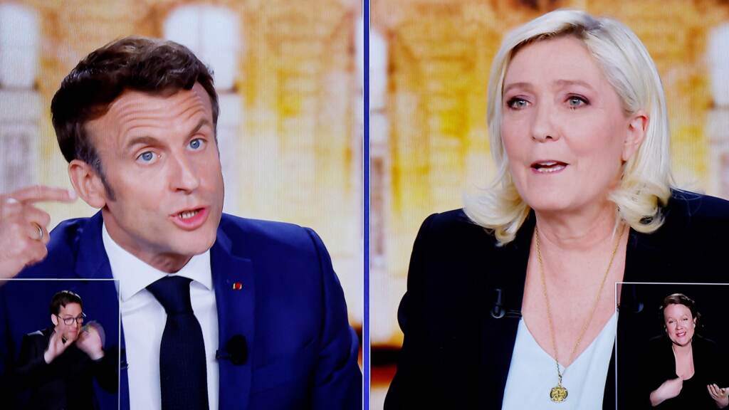 A wide gulf exists between the policies of French President Emmanuel Macron and far-right candidate Marine Le Pen. The two face off Sunday, in the second round of France’s national election. A wide gulf exists between the policies of French President Emmanuel Macron and far-right candidate Marine Le Pen. The two face off Sunday, in the second round of France's national election. (Ludovic Marin/AFP via Getty Images)