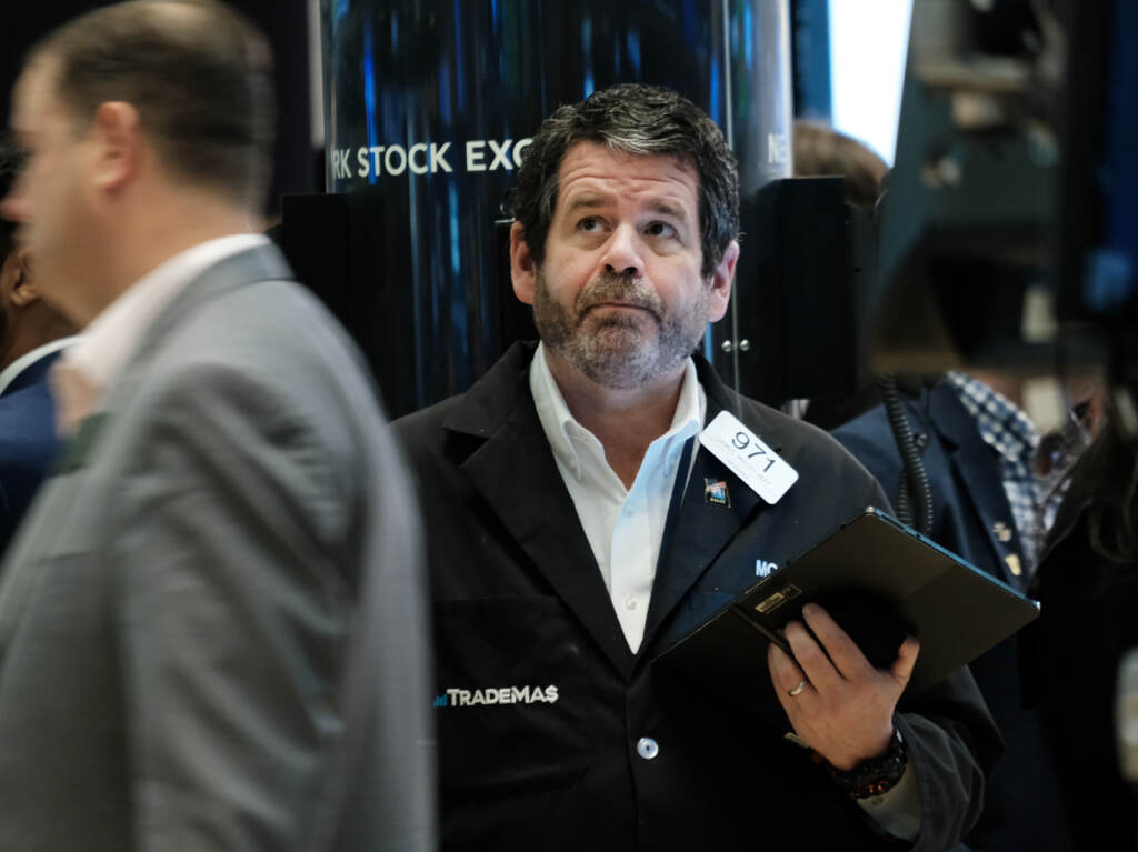 Traders work on the floor of the New York Stock Exchange (NYSE) in New York City on April 28. Stocks sank on Friday, ending a miserable month for Wall Street. Traders work on the floor of the New York Stock Exchange (NYSE) in New York City on April 28. Stocks sank on Friday, ending a miserable month for Wall Street. (Spencer Platt/Getty Images)