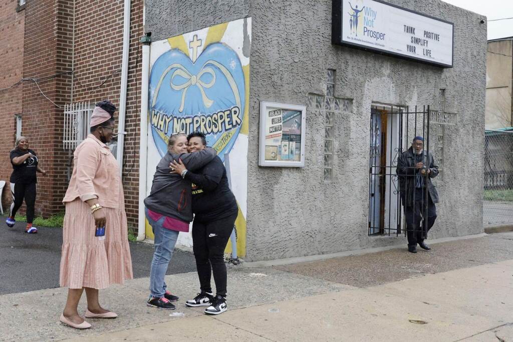 kdpmhtpwzsthqq03jt1vpe76cg Penny Martin (left) and the Rev. Michelle Simmons, founder and executive director of Why Not Prosper, hug outside of a recovery home in Philadelphia.