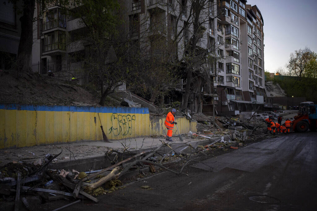 Russia Ukraine War Clean-up crews work at the explosion site in Kyiv, Ukraine on Friday, April 29, 2022. Russia struck the Ukrainian capital of Kyiv shortly after a meeting between President Volodymyr Zelenskyy and U.N. Secretary-General António Guterres on Thursday evening.