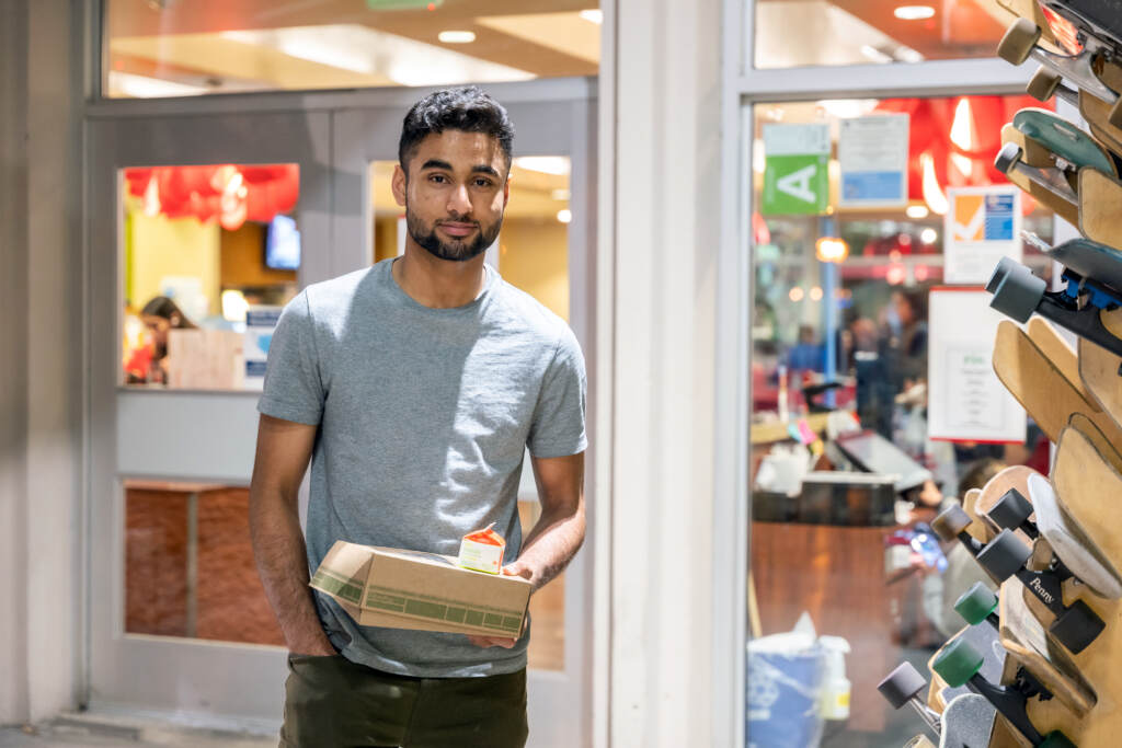 Talha Rafique picks up his to-go suhoor box from a campus dining hall at the University of Southern California. “My friends and I actually look forward to Ramadan,” he says. Talha Rafique picks up his to-go suhoor box from a campus dining hall at the University of Southern California.