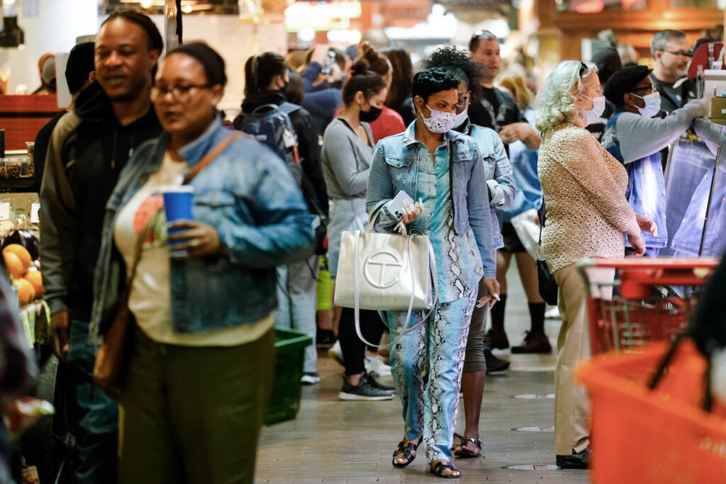 Virus Outbreak Philadelphia Customers, some wearing face masks, patronize the Reading Terminal Market