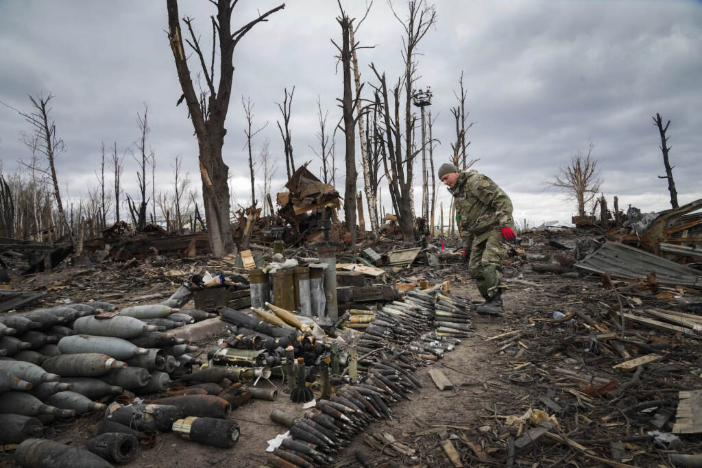 APTOPIX Russia Ukraine War An interior ministry sapper collects unexploded shells, grenades and other devices in Hostomel
