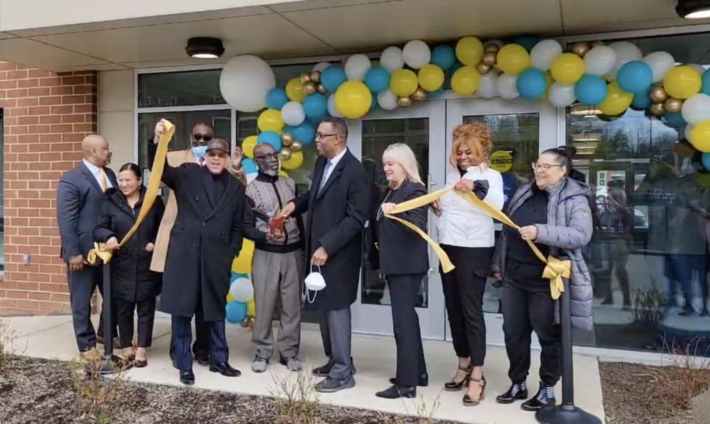 susquehanna-residences-strawberry-mansion-TM-041922 Local officials pose for a ribbon-cutting at an affordable housing cvomplex
