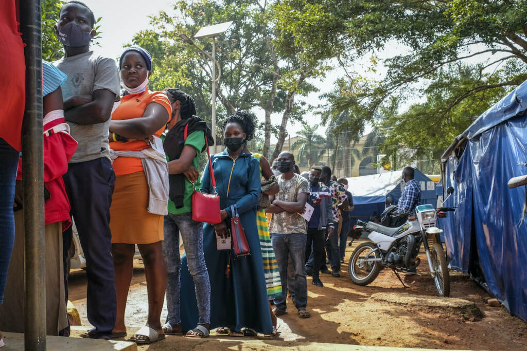 US COVID Funding Ugandans queue to receive Pfizer COVID-19 vaccinations