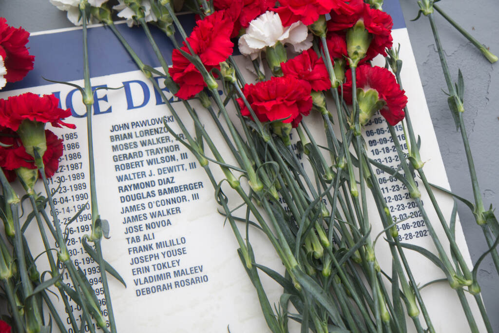 2022 05 04 k paynter living flame memorial service 2022-2-2 Names of police officers lost since 2019 are etched on the Living Flame Memorial at Franklin Square Park in Philadelphia. (Kimberly Paynter/WHYY)