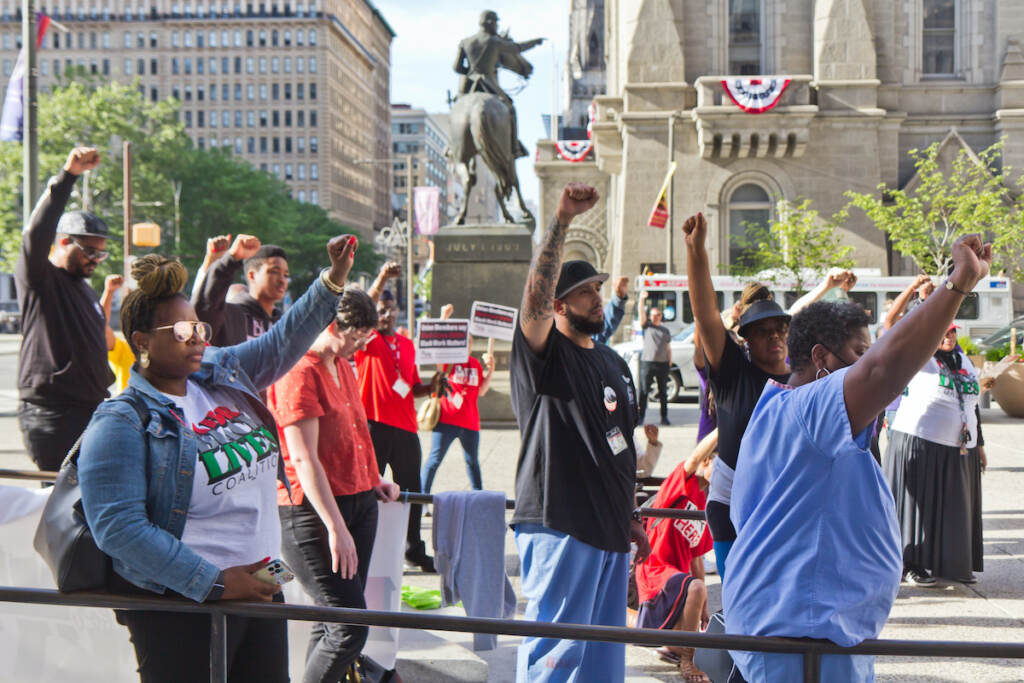 2022 05 25 k paynter 2-year george floyd vigil (1 of 1) Attendees raise fists in remembrance of George Floyd on the two-year anniversary of Floyd’s murder