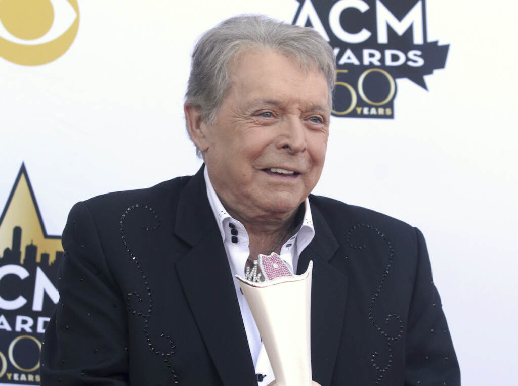 Mickey Gilley In this April 19, 2015 file photo, Mickey Gilley poses with the triple crown award on the red carpet at the 50th annual Academy of Country Music Awards at AT&T Stadium in Arlington, Texas. Country music artist Gilley and his son were injured in a car accident in Texas, but both are recovering after minor injuries. A statement from Gilley's publicist on Thursday, Jan. 4, 2018, said the two were injured Wednesday when their car rolled over. (Photo by Jack Plunkett/Invision/AP, File)