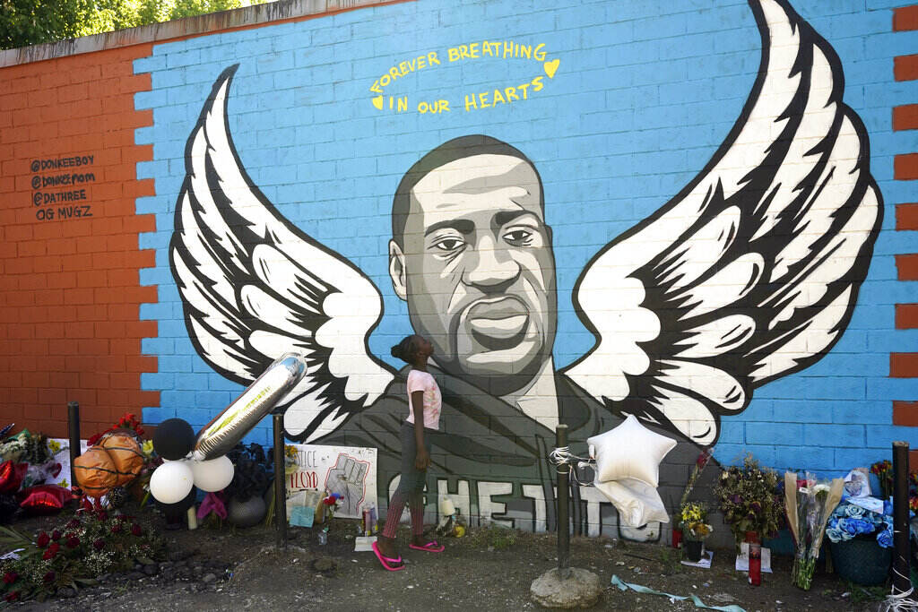 Nala Williams Nala Williams, 8, looks up at a mural honoring George Floyd in the Third Ward, Sunday, June 7, 2020, in Houston. (AP Photo/David J. Phillip