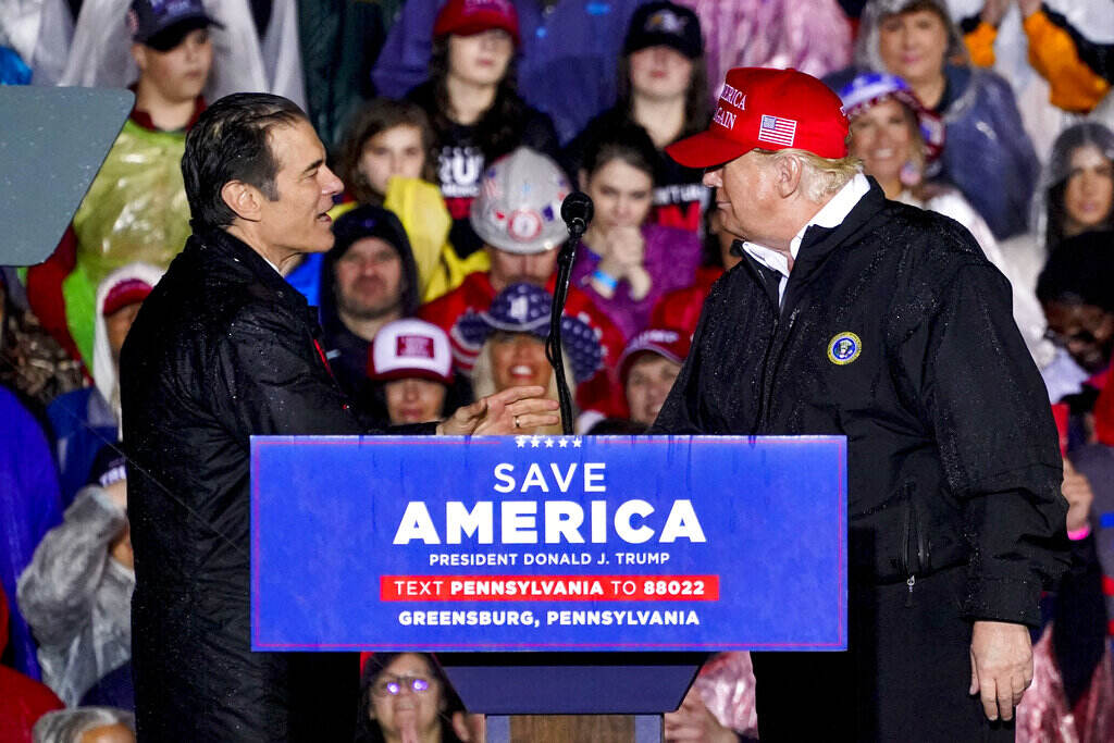 Election 2022 Senate Pennsylvania Pennsylvania Senate candidate Mehmet Oz, left, accompanied by former President Donald Trump, speaks at a campaign rally in Greensburg, Pa., Friday, May 6, 2022. (AP Photo/Gene J. Puskar)