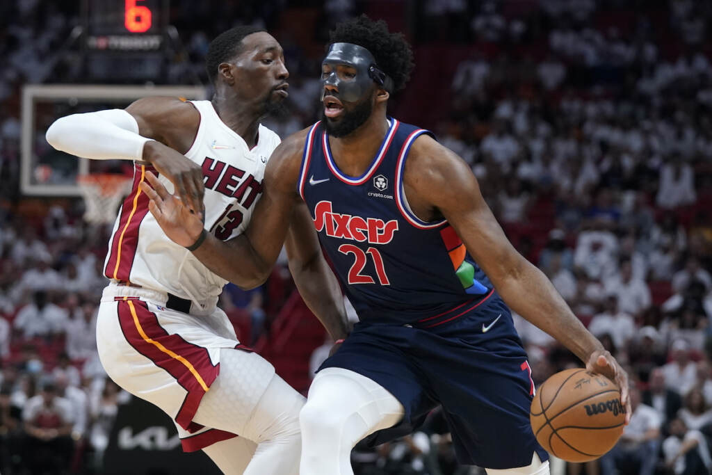 Joel Embiid,Bam Adebayo Philadelphia 76ers center Joel Embiid (21) drives up against Miami Heat center Bam Adebayo (13) during the first half of Game 5 of an NBA basketball second-round playoff series, Tuesday, May 10, 2022, in Miami. (AP Photo/Wilfredo Lee)