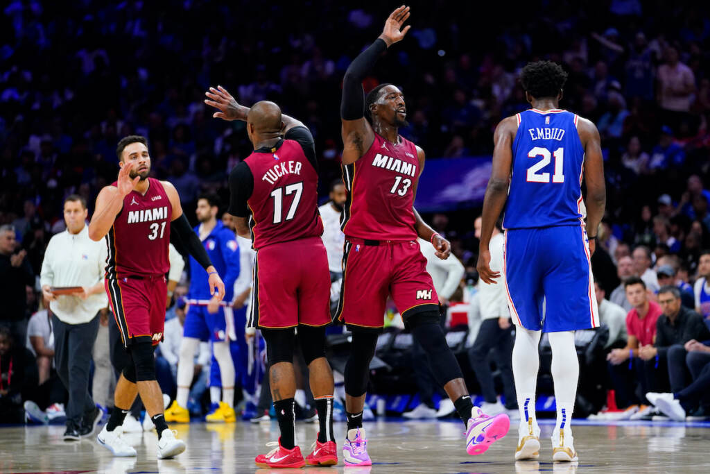 Heat 76ers Basketball Miami Heat's Bam Adebayo (13), P.J. Tucker (17), and Max Strus (31) celebrate past Philadelphia 76ers' Joel Embiid (21) during the second half of Game 6 of an NBA basketball second-round playoff series, Thursday, May 12, 2022, in Philadelphia. (AP Photo/Matt Slocum)