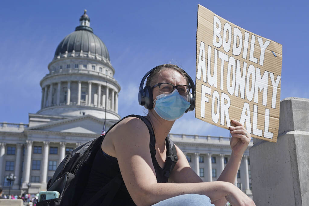 A woman attends an abortion-rights rally at the Utah State Capitol Saturday, May 14, 2022, in Salt Lake City. (AP Photo/Rick Bowmer)
