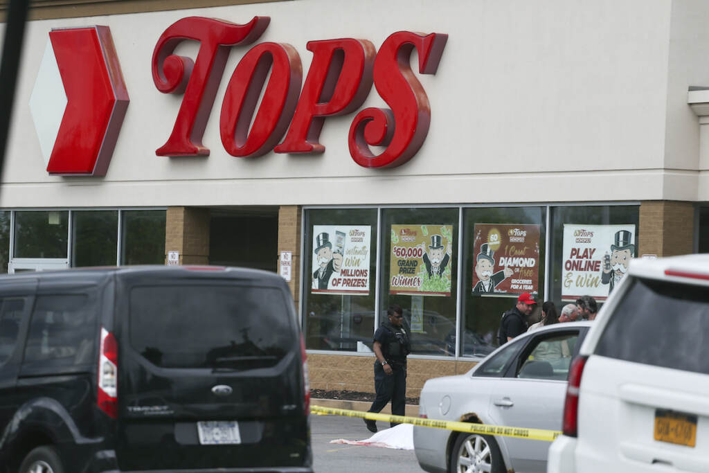 Police investigate after a shooting at a supermarket on Saturday, May 14, 2022, in Buffalo, N.Y.  (AP Photo/Joshua Bessex)