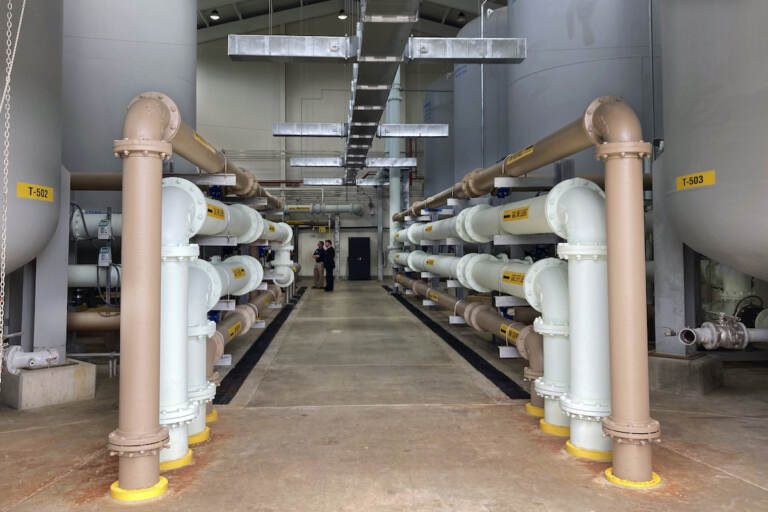 Federal and state officials unveiled more than a half a billion dollars in federal and state low-interest loans to finance some nearly 30 drinking and surface water infrastructure projects around New Jersey, Friday, May 20, 2022. (AP photo by Mike Catalini)