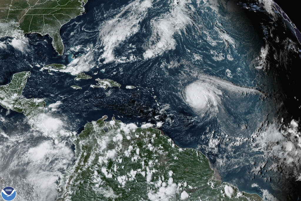 Hurricane Outlook This satellite image provided by the National Oceanic and Atmospheric Administration shows Hurricane Sam, just right of center, in the Atlantic Ocean, Monday, Sept. 27, 2021, at 1920 Zulu (3:20 p.m. ET). (NOAA via AP)