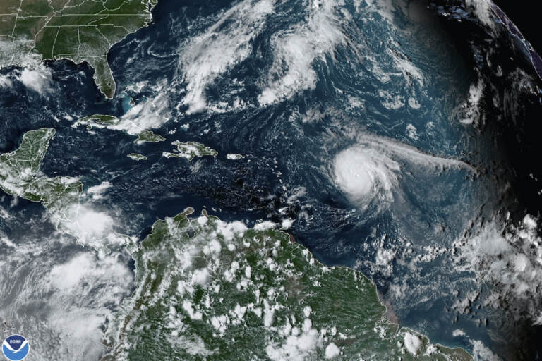 This satellite image provided by the National Oceanic and Atmospheric Administration shows Hurricane Sam, just right of center, in the Atlantic Ocean, Monday, Sept. 27, 2021, at 1920 Zulu (3:20 p.m. ET). (NOAA via AP)