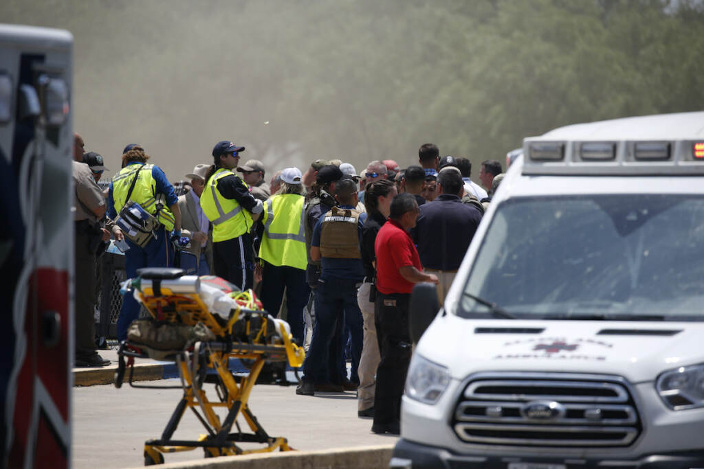 Texas School-Shooting Emergency personnel gather near Robb Elementary School following a shooting