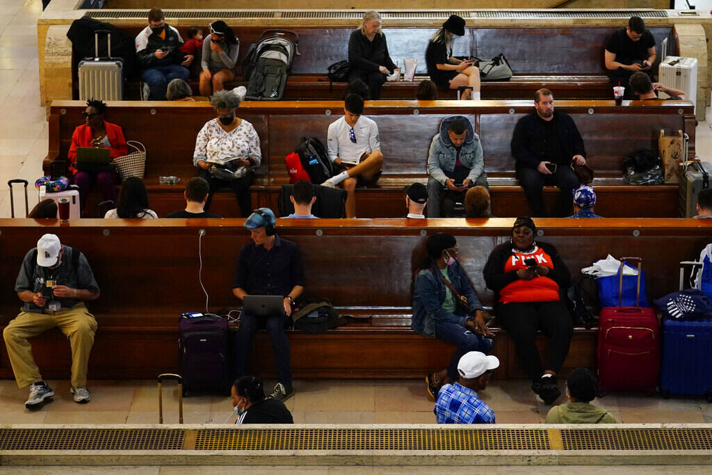Travelers wait at 30th Street Station ahead of Memorial Day weekend, Friday, May 27, 2022, in Philadelphia, Pa. (AP Photo/Matt Slocum)