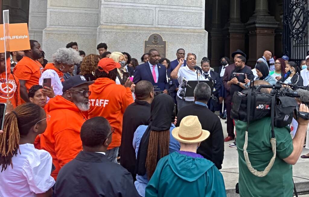 Interfaith leaders, youth mentors, law enforcement representatives and elected officials spoke at an anti-gun violence rally at City Hall Thursday. Mothers in Charge, a nonprofit led by mothers who’ve lost children to gunfire, organized the event. Interfaith leaders, youth mentors, law enforcement representatives and elected officials spoke at an anti-gun violence rally at City Hall Thursday. Mothers in Charge, a nonprofit led by mothers who've lost children to gunfire, organized the event. (Sammy Caiola/WHYY)