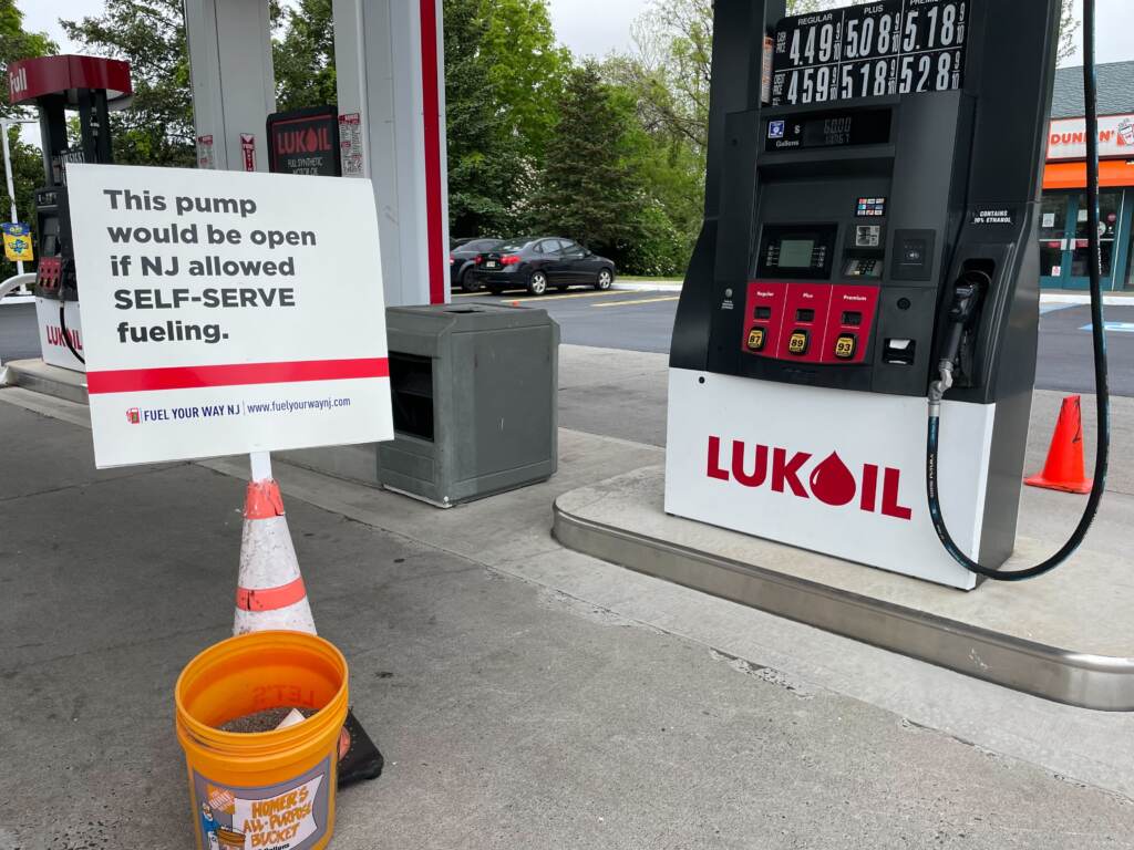 Orange cones at the Lukoil gas station on Route 1 South in West Windsor altering motorists that the gas pump would be open for self-service if New Jersey allowed it. It was part of a demonstration to support a bill in the Assembly that would allow a self-serve option. (P. Kenneth Burns/WHYY)