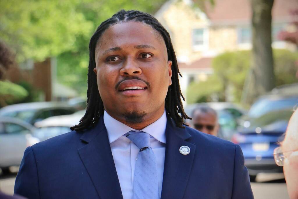 Pa. State Rep. Malcolm Kenyatta (left), running for the Democratic nomination for U.S. Senate, greets voters as they arrive at the polling place at Elkins Park School.