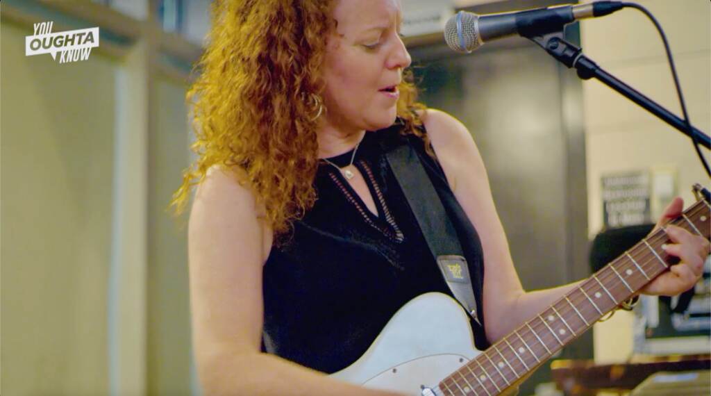 YOK LBF Artist playing guitar at Ladybug Festival