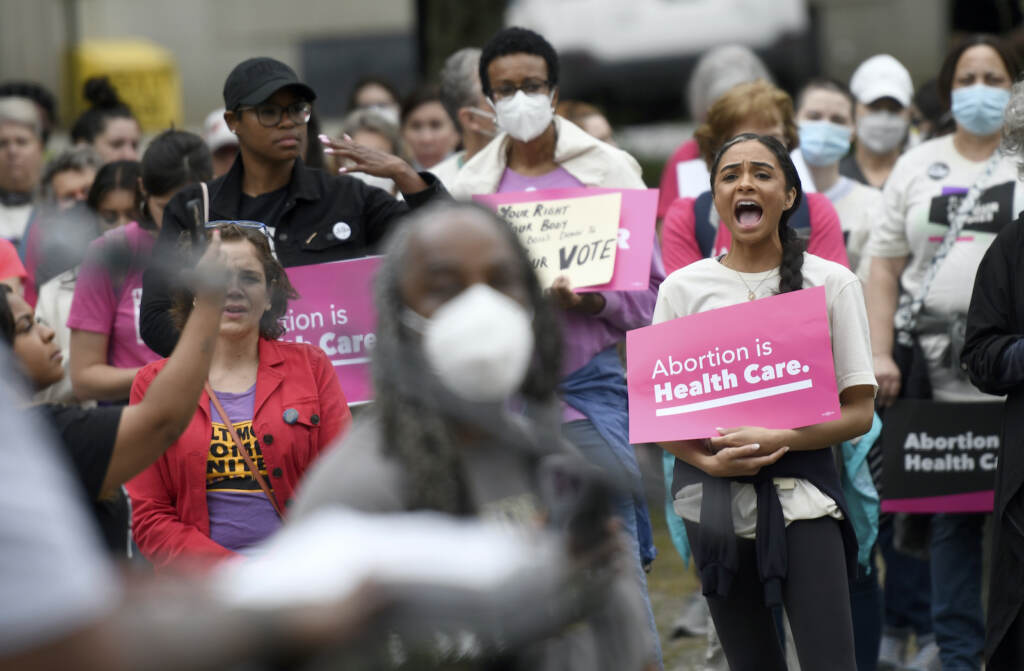 Chandler Jones Chandler Jones, right, 26, from Baltimore County who will graduate this spring from the University of Baltimore School of Law, participates in a pro-choice rally in Baltimore, Saturday, May 14, 2022. (AP Photo/Steve Ruark)