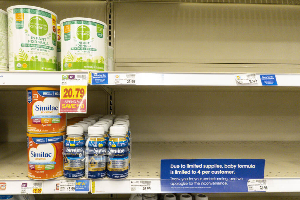 Baby formula is displayed on the shelves of a grocery store with a sign limiting purchases in Indianapolis on Tuesday. Baby formula is visible on the shelves of a grocery store.