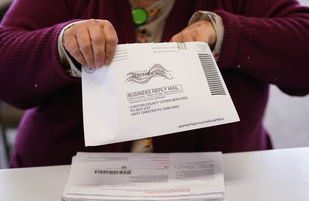 Election worker Monica Ging processes a ballot for Pennsylvania’s primaries this month at the Chester County Voter Services office in West Chester, Pa. File photo: Election worker Monica Ging processes a ballot for Pennsylvania's primaries this month at the Chester County Voter Services office in West Chester, Pa. (Matt Slocum/AP)