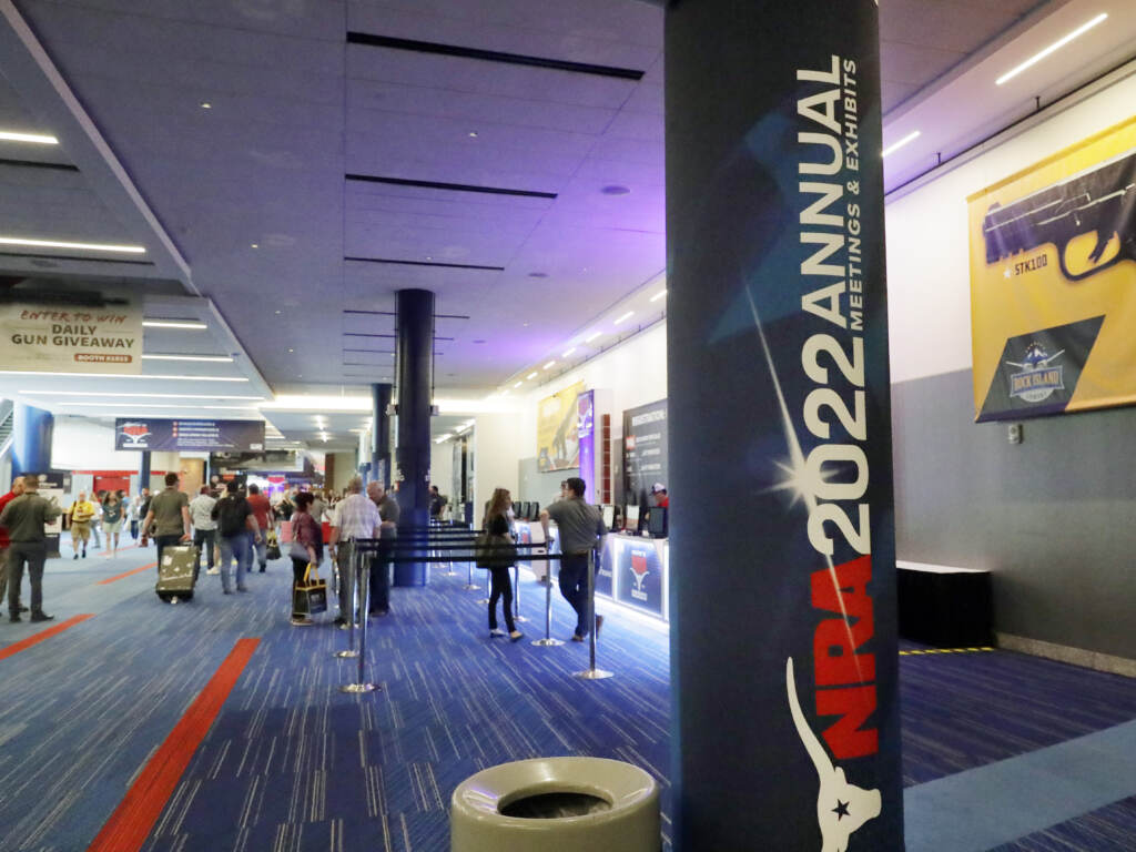Attendees of the NRA’s annual convention gather by booths in the exhibit halls of the George R. Brown Convention Center in Houston on Thursday. Attendees of the NRA's annual convention gather by booths in the exhibit halls of the George R. Brown Convention Center in Houston on Thursday. (Michael Wyke/AP)