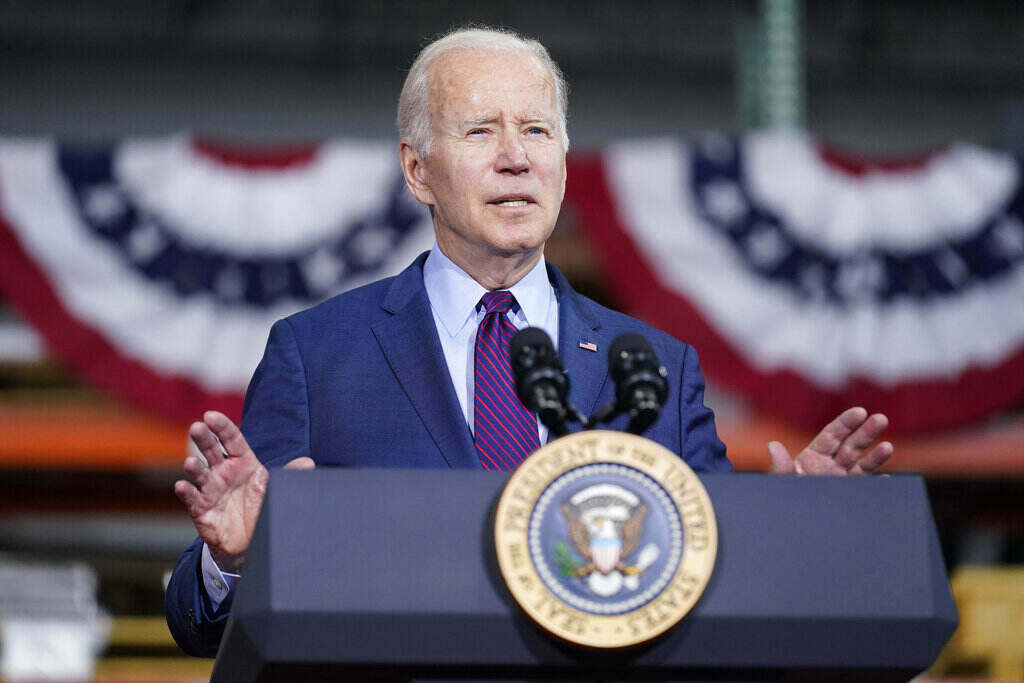 President Joe Biden speaks at a podium.