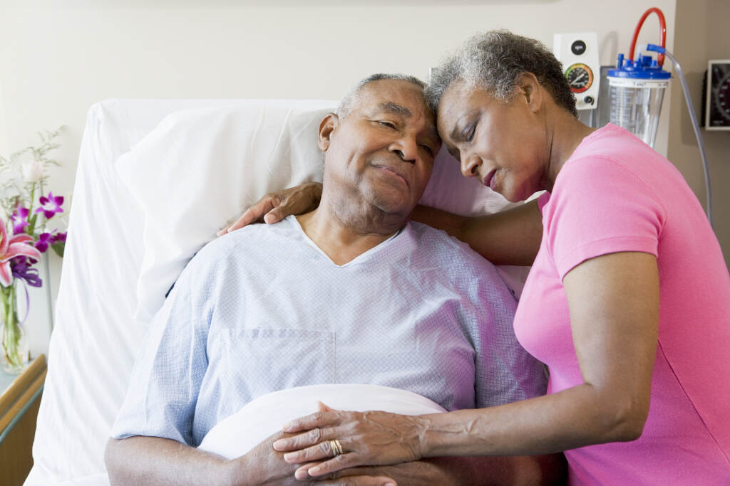 Senior Couple Embracing In Hospital Senior Couple Embracing In Hospital