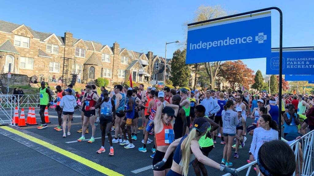 Runners stretch and prepare to race at the starting line for the 2022 Broad Street Run.