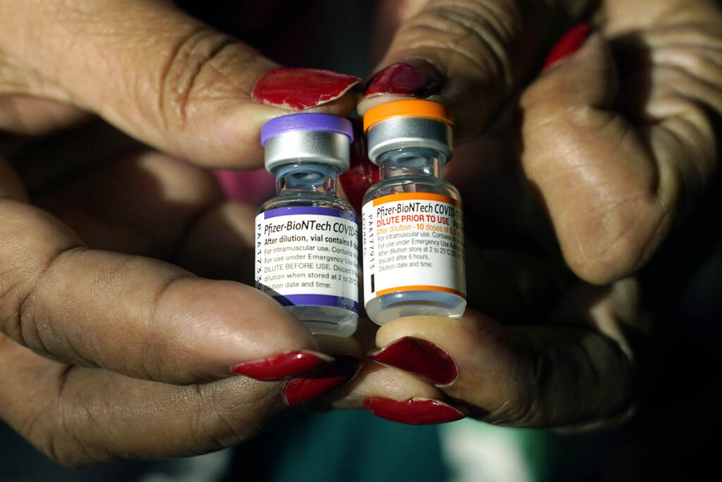 Virus Outbreak Kid Vaccine Booster A nurse's hands hold two different vials of COVID-19 vaccine