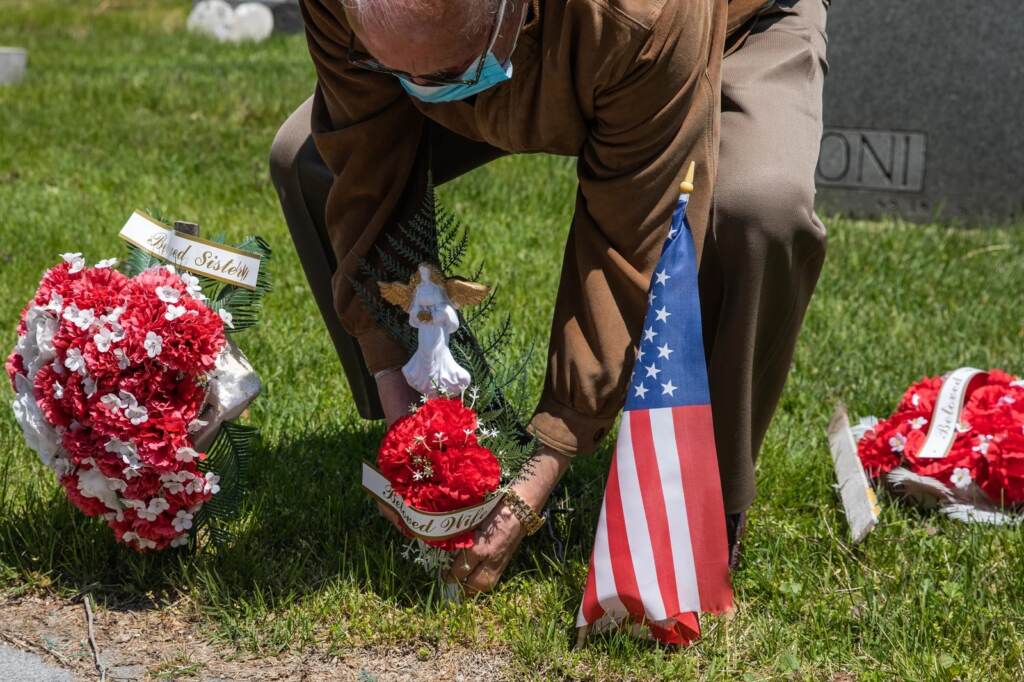 gettyimages-1212461767_custom-7d31f4888d53a10e497792943c33af75299c0be9-s1600-c85 A man puts flower on his wife's grave at Calvary Cemetery on May 10, 2020, in the Queens borough of New York City. Mother's Day can be a painful time, especially for people living with loss. (Jeenah Moon/Getty Images)