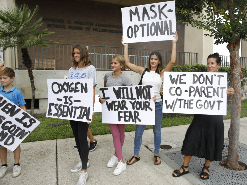 Anger over issues such as the mask mandate galvanized families — like these seen at the Hillsborough County School Board in Tampa, Fla., last year — into running for school board. Progressive groups are taking a leaf out of their playbook. Anger over issues such as the mask mandate galvanized families — like these seen at the Hillsborough County School Board in Tampa, Fla., last year — into running for school board. Progressive groups are taking a leaf out of their playbook. (Octavio Jones/Getty Images)