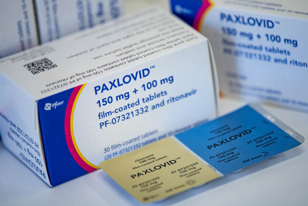 The Pfizer COVID treatment Paxlovid can be a challenge to get quickly. The drug Paxlovid is seen on a table
