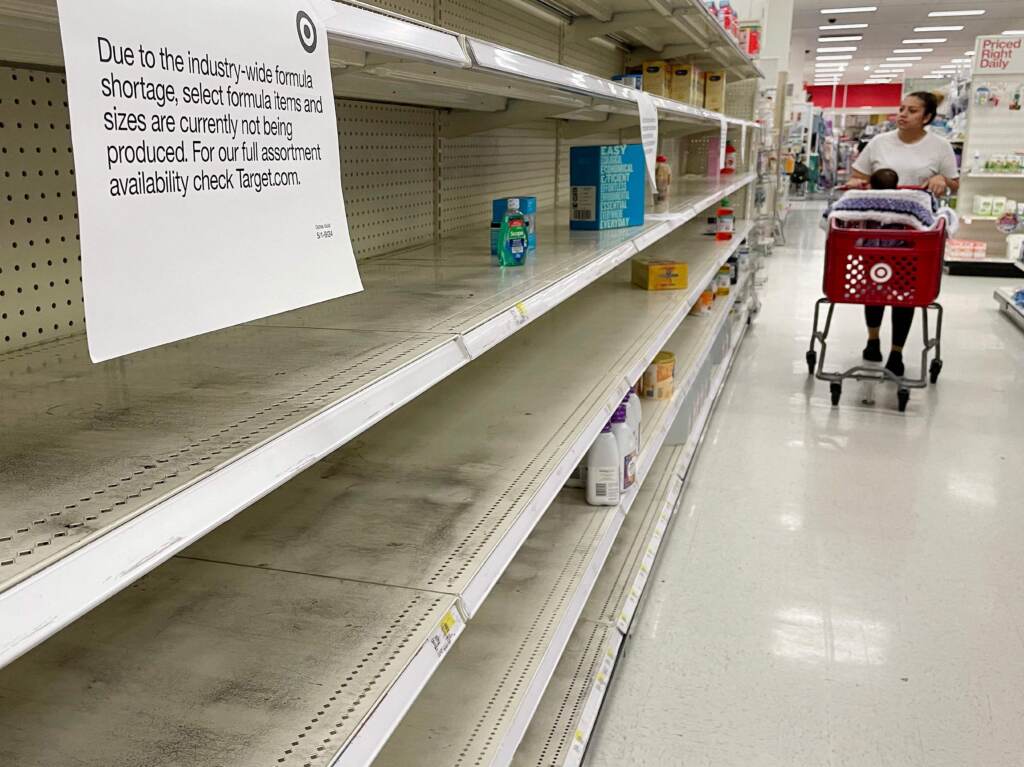 A woman shops for baby formula in Annapolis, Md., on May 16. Only a handful of companies supply baby formula in the country, a factor that has contributed to the current shortages being experienced in parts of the country. A woman shops for baby formula at Target