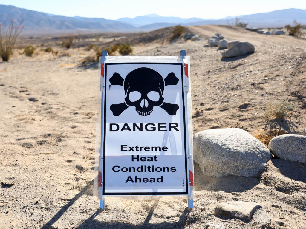 A sign reads “Danger Extreme Heat Conditions Ahead” in Anza-Borrego Desert State Park, which is threatened by climate change, on March 23 near Borrego Springs, Calif. A sign reads
