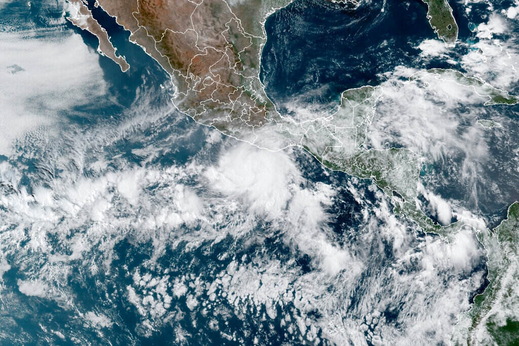 Tropical Weather Hurricane Agatha This satellite image made available by NOAA shows Hurricane Agatha, center, off the Pacific coast of Mexico on Sunday, May 29, 2022, at 11:20 a.m. EDT.