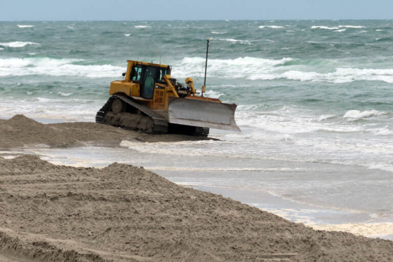 A bulldozer on a beach