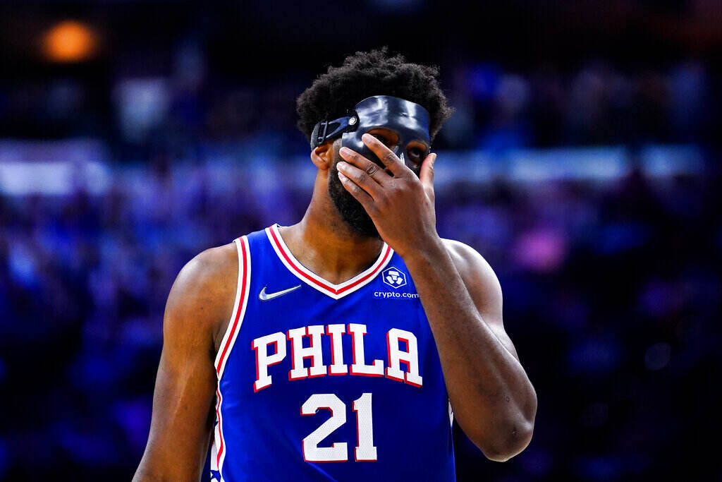 Heat 76ers Basketball Joel Embiid puts his hand over his face during a playoff game with the Miami Heat.