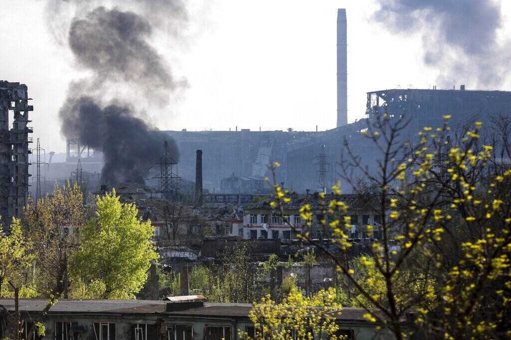 Ukraine Russia Smoke rises from the Metallurgical Combine Azovstal in Mariupol, in territory under the government of the Donetsk People's Republic, eastern Ukraine, Wednesday, May 4, 2022.