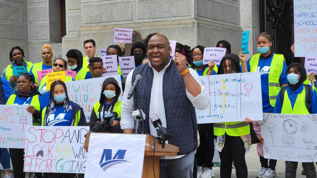 mastery-charter-schools-protest-safety-TM-051222-01 LeYondo Dunn speaks from a podium with protesters behind him