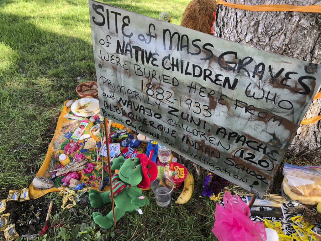 Native Americans-Boarding Schools A makeshift memorial under a tree at a public park
