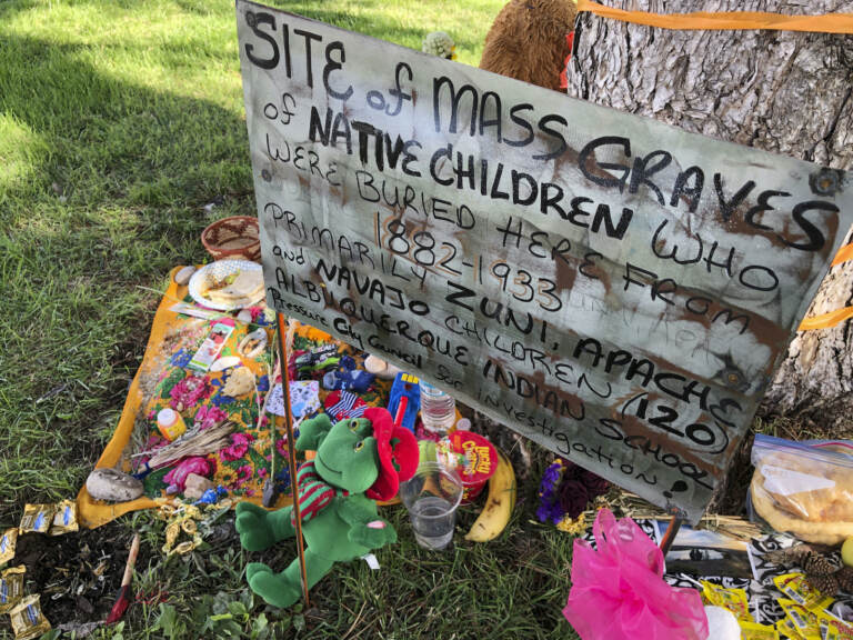 A makeshift memorial under a tree at a public park