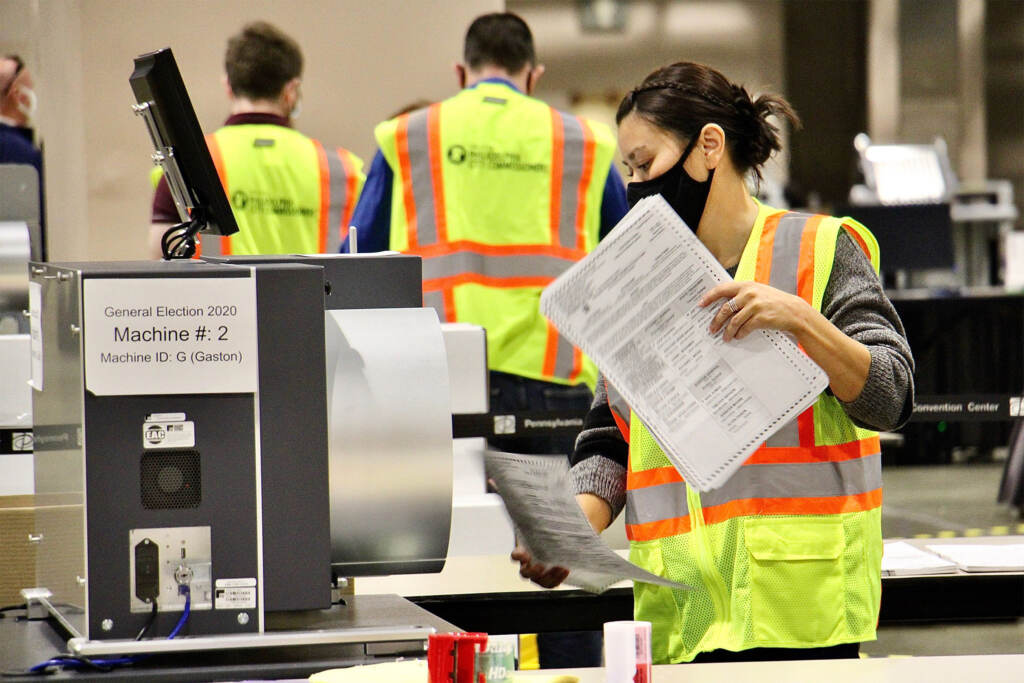 phillyelection2020-ballotcounting-conventioncenter-01 Workers tally mail ballots inside the Pa. Convention Center on Election Day
